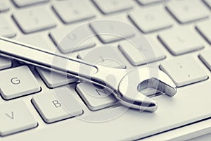 Wrench on computer keyboard