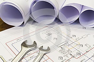 Wrench and project drawings with plumbing system