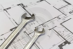 Wrench and project drawings with residential building