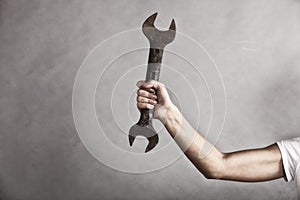 Wrench spanner tool in hand of female worker