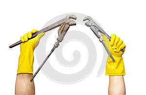Wrench in yellow rubber gloves