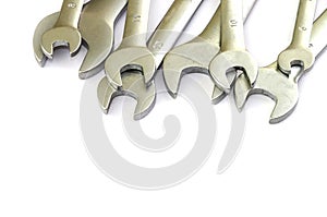 Wrenches of different sizes on a white background