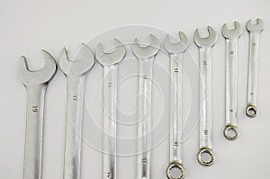 Wrenches of different sizes on a white background
