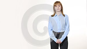 Wringing his fingers. uncertainty. girl in pants and blous. Isolated on white background. body language. women gestures