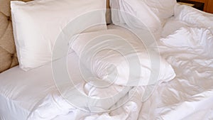 wrinkle messy blanket and white pillow in bedroom after waking up in the morning