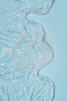 Wrinkled cling film, blue vinyl art background, water waves effect texture.