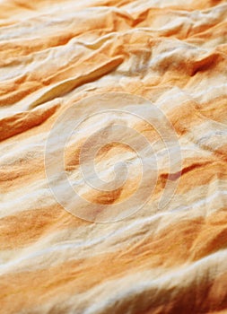 The wrinkled of clothes pattern orange color for background