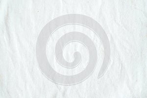 Wrinkled white cotton fabric texture background, wallpaper