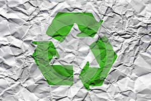 Wrinkled White Paper with Green Recycling Symbol