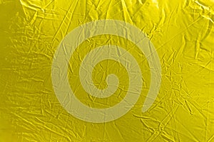Wrinkled yellow cloth as background