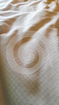 Wrinkles of white sheets in the bedroom