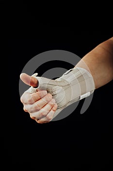 Wrist and hand orthotics support for carpal tunnel syndrome healing, isolated on black