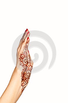 Wrist and hand of young girl with henna mehendi