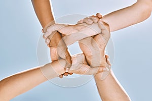 Wrist hands, teamwork and diversity, support or community, trust or cooperation on blue sky. Collaboration, business