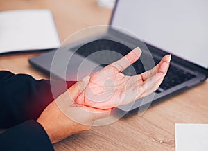 Wrist, pain and business woman with laptop, mockup or screen in office closeup with injury. Hand, red and lady manager