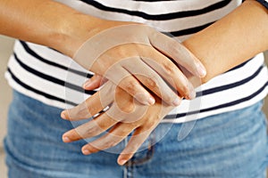 Wrist pain is one of the symptoms that can indicate