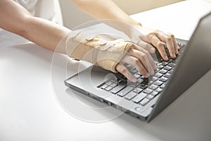 Wrist pain from using computer, office syndrome hand pain or injury photo