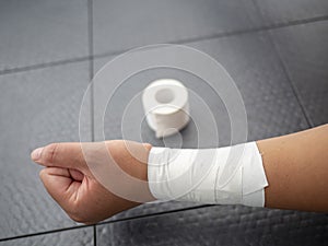 Wrist tape job and roll of tape