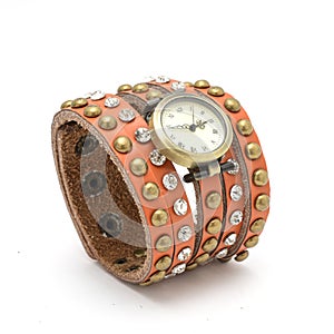 Wrist watch with orange  strap isolated on white