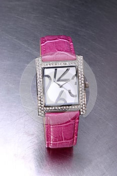 wrist watch with pink leather wristband for women on steel underground