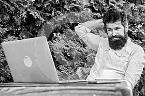 Write article for online magazine. Man looking for inspiration. Find topic write. Bearded hipster laptop surfing
