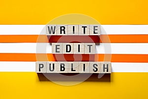 Write edit publish word concept on cubes