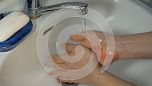 Write on hand virus. Women washing hands the best way at home coronavirus rinse water rub soap dry towel extreme close