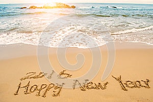 Write happy new year 2016 on beach