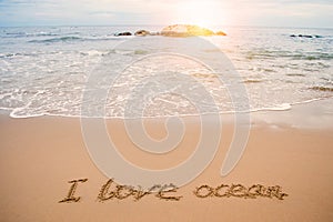 Write love ocean on beach