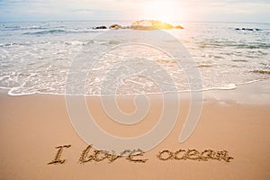 Write love ocean on beach