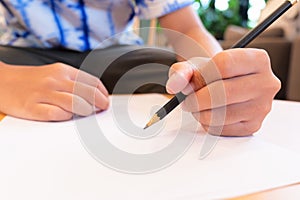 Write on paper sheet with left hand