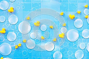 blue background with tiny bubbles and yellow ducks photo