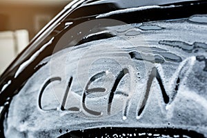 Write the word clean on the windshield washes.