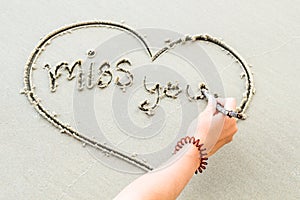 Write the word love letters on the sand