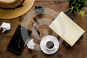 Writer`s block concept. Notebook, pen, crumpled paper on dark wooden background top-down flay lay