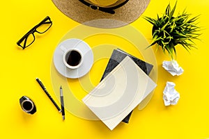 Writer`s block concept. Notebook, pen, crumpled paper on yellow background top-down