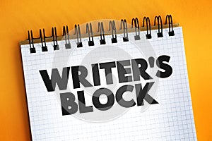 Writer`s block text quote on notepad, concept background