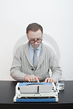 Writer typing on typewriter