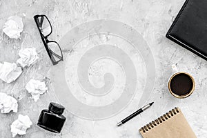 Writer workplace with tools for work on stone table background top view mockup