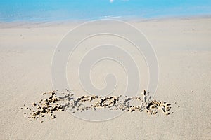 Writing beach on sand