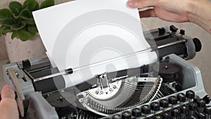 Writing a book and typing old typewriter, top view. Man typing on old vintage retro typewriter. News, media or