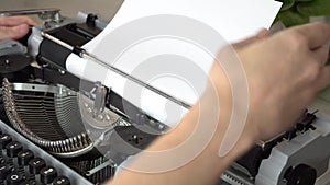 Writing a book and typing old typewriter, top view. Man typing on old vintage retro typewriter. News, media or