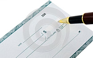 Writing a check with ballpoint pen photo