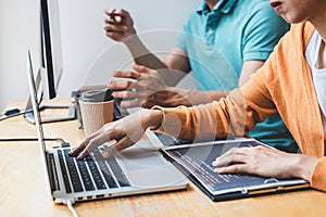 Writing codes and typing data code technology, Programmer cooperating working on web site project in a software developing on