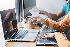 Writing codes and typing data code technology, Programmer cooperating working on web site project in a software developing on
