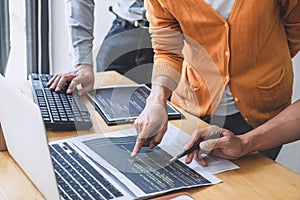 Writing codes and typing data code technology, Programmer cooperating working on web site project in a software developing on