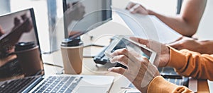 Writing codes and typing data code technology, Programmer cooperating working on web site project in a software developing on