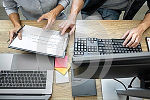 Writing codes and typing data code technology, Programmer team working on web site project in a software development on desktop