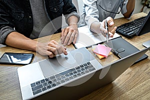 Writing codes and typing data code technology, Programmer team working on web site project in a software development on desktop