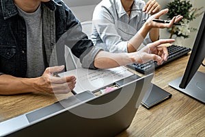 Writing codes and typing data code technology, Programmer team working on web site project in a software development on desktop